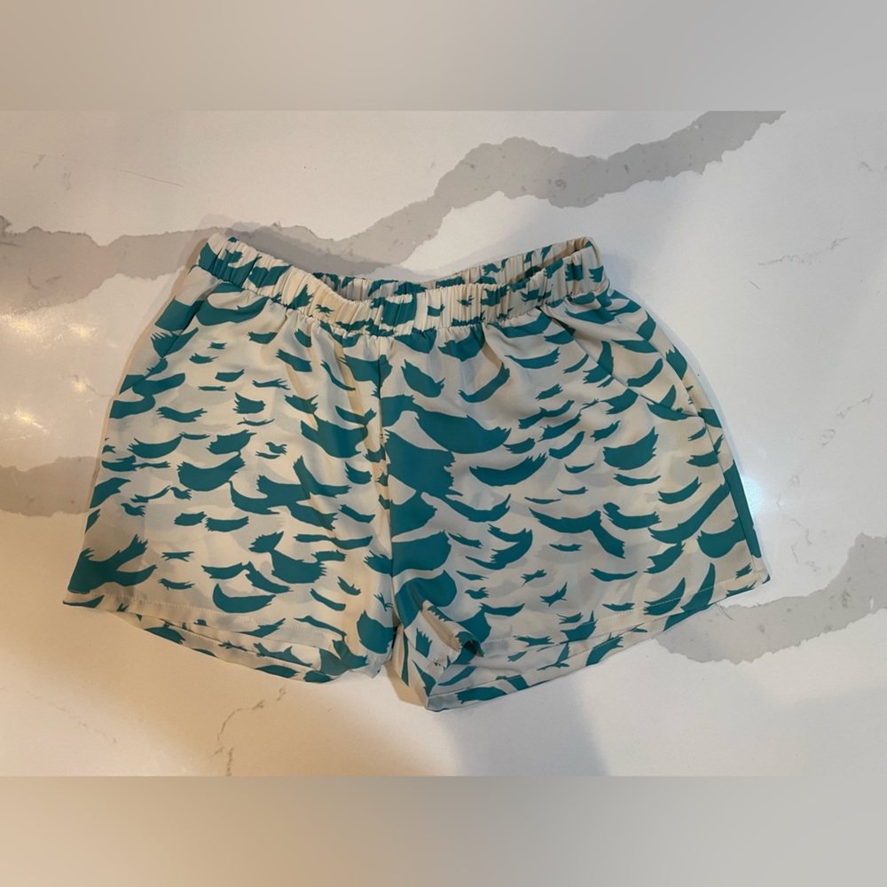 Pattern light weight shorts. Elastic waist with pockets.